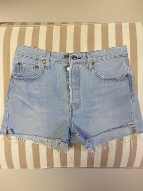 Levi's Women’s 501 Original Shorts
Light Blue Denim 
Frayed Hem
Cut 1” on sides